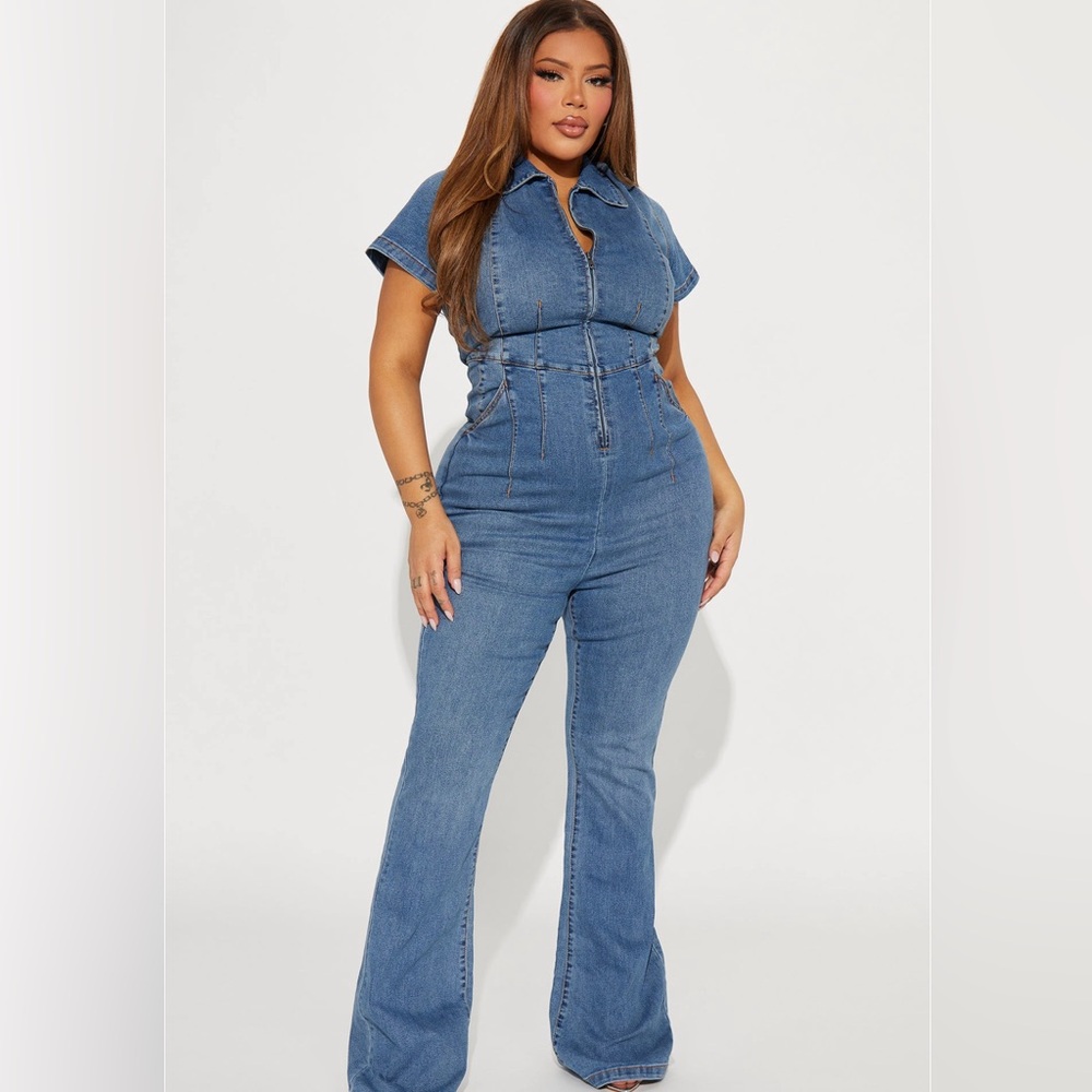 Denim jumpsuit. Brand new. Tall girl friendly (smoke free home)